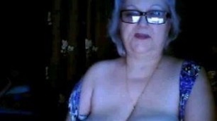 Russian granny ex-teacher flashing her big tits on  webcam